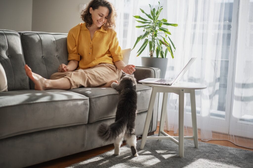Woman with cat at home
